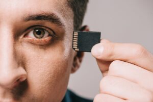 selective focus of man implanting microchip in hea 2023 11 27 05 17 53 utc